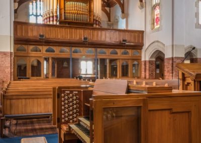 Carved wooden choir stalls and organ console in St Paul's church