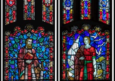 Two stained glass windows depicting saints in St Paul's church