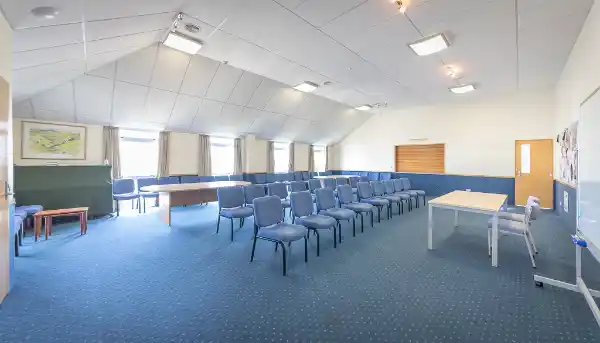 The Brechin Lounge set up with rows of chairs, seating about 60 people
